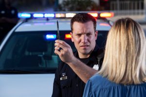 woman being given dwi field sobriety tests by police